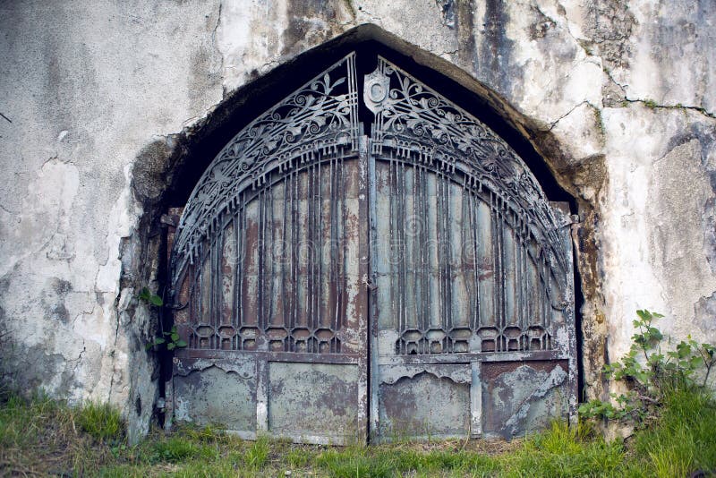Iron door gate in the wall royalty free stock photography Iron door gate in the wall royalty free stock photography