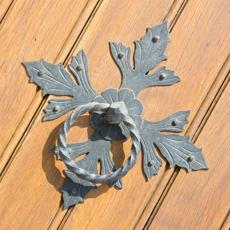 Iron door knocker stock image. Image of door, iron, lily 58068431