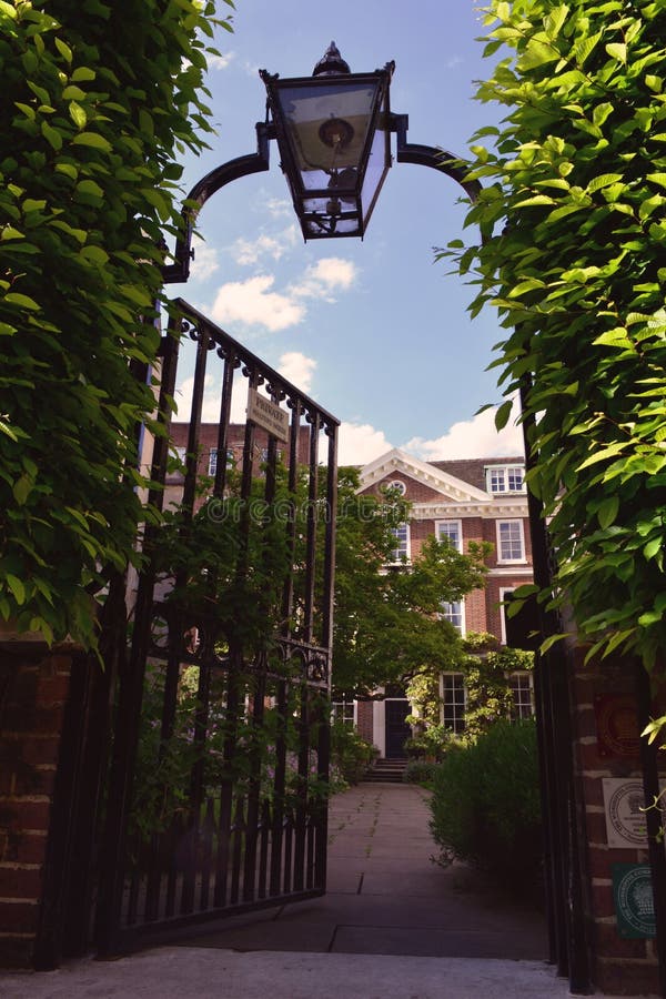 Iron gate door with the lantern leading to the private garden and house