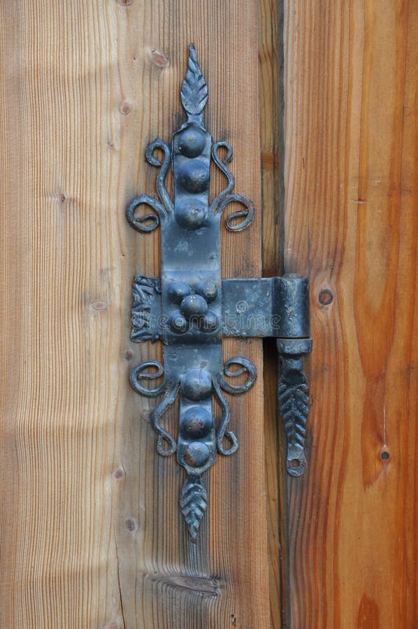 Old iron hinge on the door