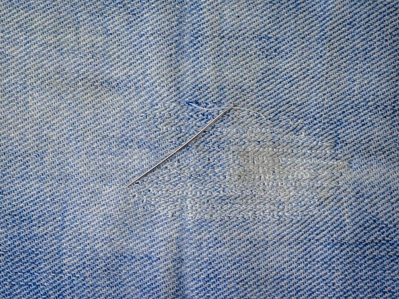 Iron Needle with Thread on the Repaired Denim. Repair of Jeans at Home ...