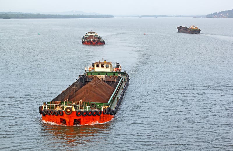 Iron Ore Carrying Cargo Barges royalty free stock image Iron Ore Carrying Cargo Barges royalty free stock image
