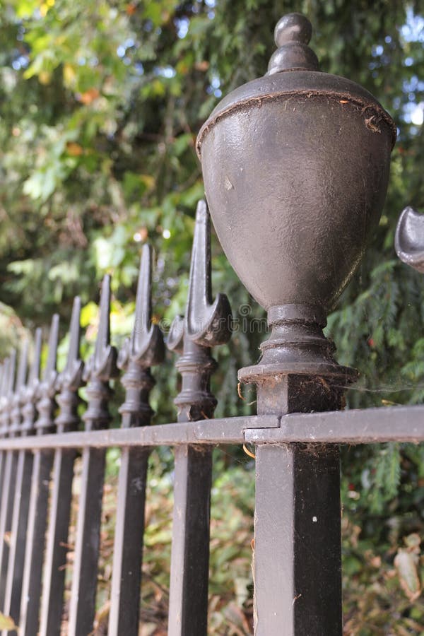 Iron Railings Bordering a London Garden Square in Autumn Stock Image