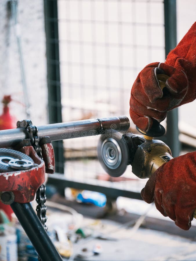 Iron Soldering, Man Working on Iron Soldering, Welding Sparks Stock