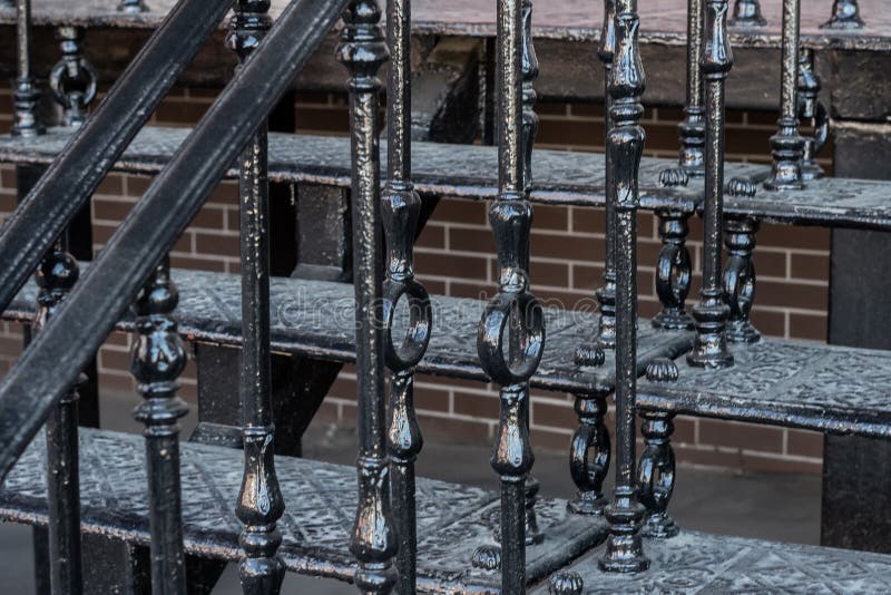 Metal staircase and wrought iron railing