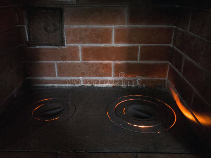 Iron Stove of Red Bricks with Cooking Hob Front Top View Stock Photo