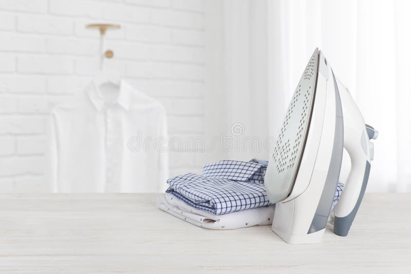 Iron on Wooden Board with Clothes, Ironing Board Household Concept
