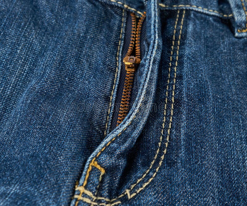 Iron Yellow Zipper on the Fly on Blue Jeans Stock Image - Image of ...