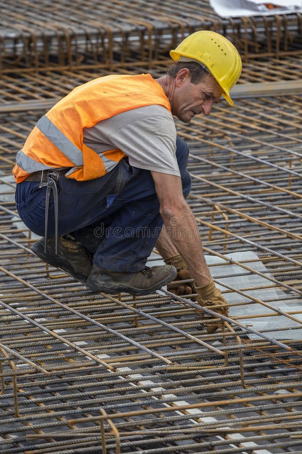 Ironworkers install rebar editorial stock image. Image of occupation