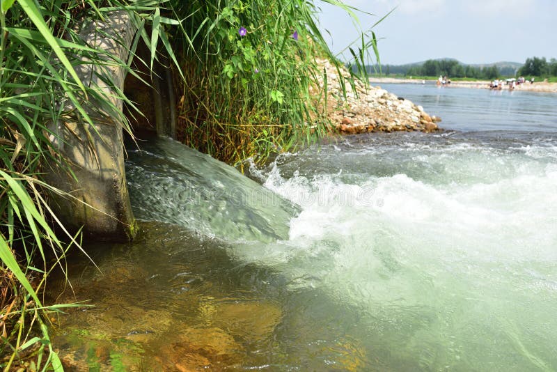 A irrigation pipes with diversion effect in river. Whirlpool vortex water stock images, royalty-free photos and pictures
