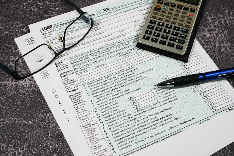 IRS Form 1040 with Calculator Pen and Glasses Stock Photo Image of
