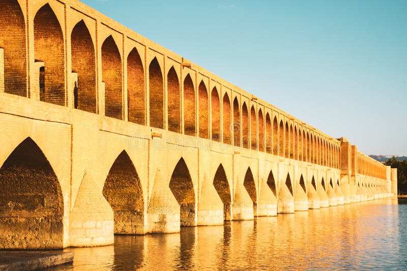 Isfahan, Iran - May 2022: SioSe Pol or Bridge of 33 arches, one of the oldest bridges of Esfahan and longest bridge on Zayandeh River. Isfahan, Iran - May 2022: SioSe Pol or Bridge of 33 arches, one of the oldest bridges of Esfahan and longest bridge on Zayandeh River.