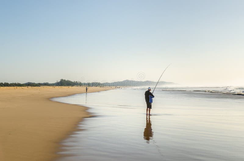 Isimangaliso wetland man fishing in the indian ocean