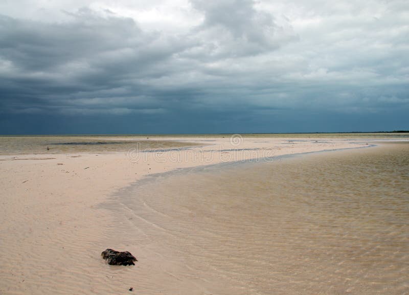 Isla Blanca beach under stormy skies on the Isla Blanca peninsula Cancun Mexico