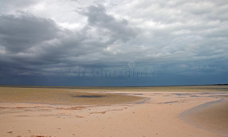 Isla Blanca beach under stormy skies on the Isla Blanca peninsula Cancun Mexico