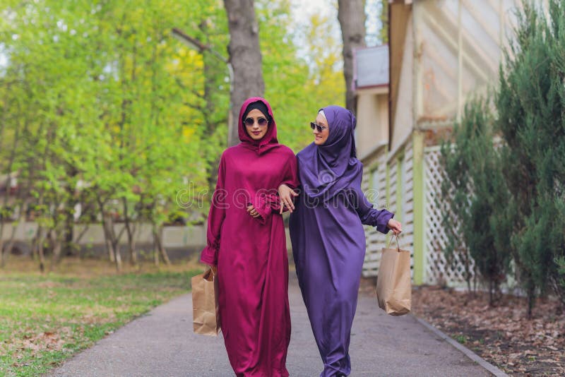 Islamic Beautiful Woman in a Muslim Dress Standing on a Summer Park ...