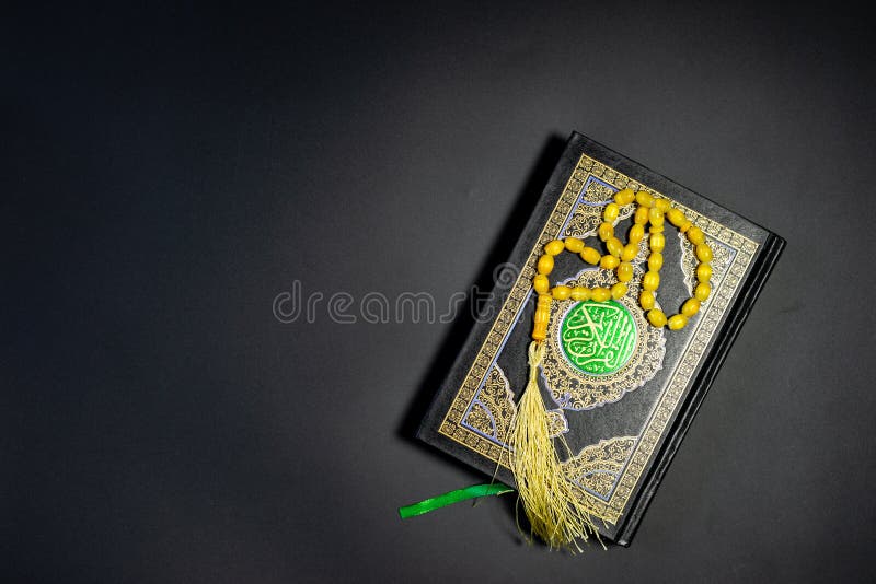 Islamic Concept - Holy Quran on Black Background. Shallow Depth of ...