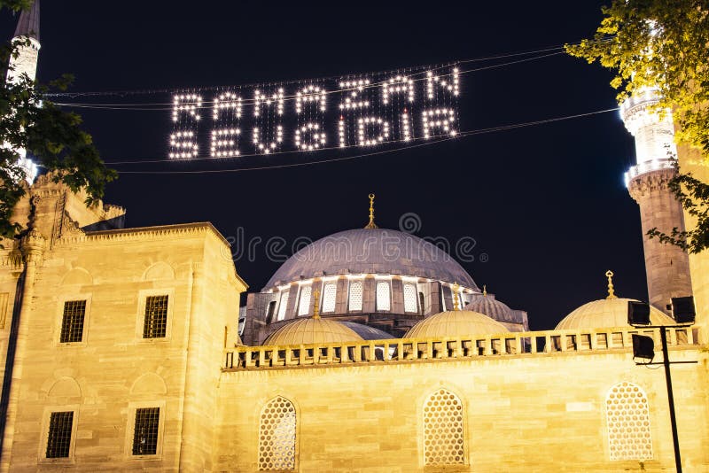 Islamic message lettering hanging on Suleymaniye Mosque\ s mahya is: \ Ramadan is love\ .