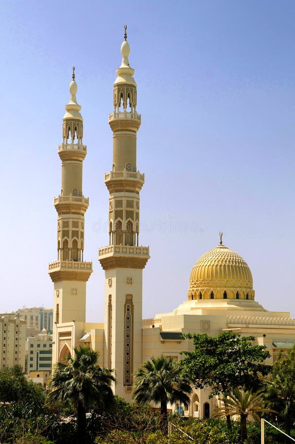 Scenic view of Islamic mosque with two tall minaret towers, Dubai city, United Arab Emirates. Scenic view of Islamic mosque with two tall minaret towers, Dubai city, United Arab Emirates.