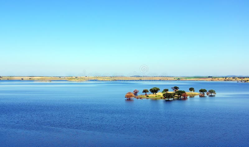 Island in blue Lake. stock photography