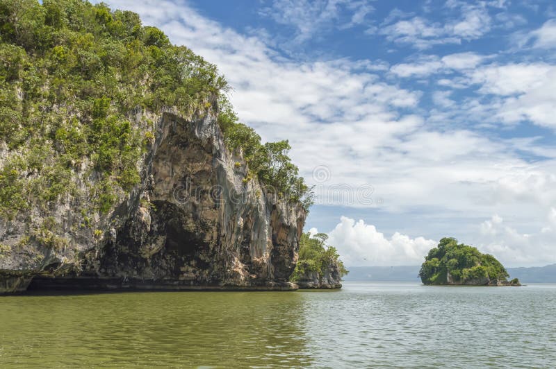 Island, Rock In The Atlantic Ocean Covered With Green Vegetation