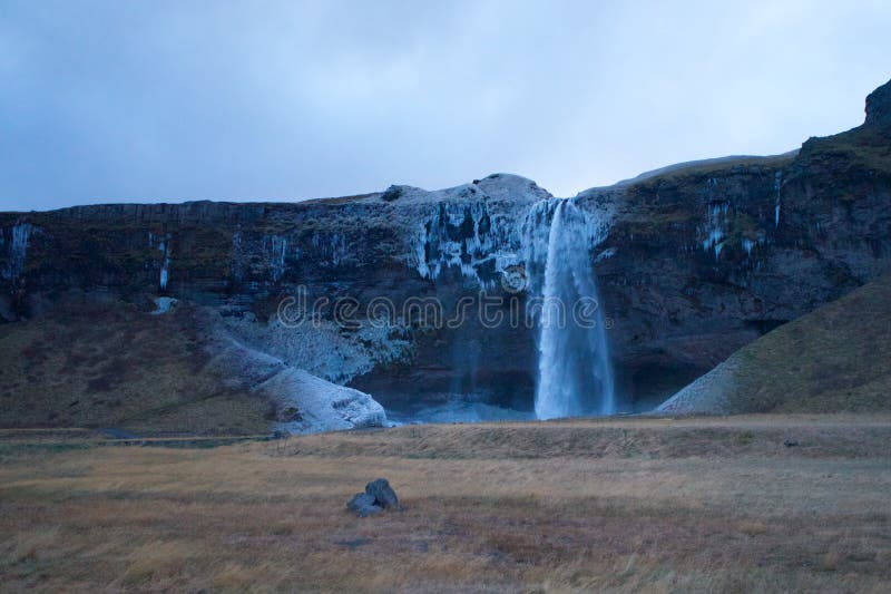 Island Seljalandsfoss vattenfallspanorama royaltyfri bild Island Seljalandsfoss vattenfallspanorama royaltyfri bild