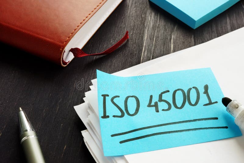 ISO 45001 handwritten on the piece of paper royalty free stock photo