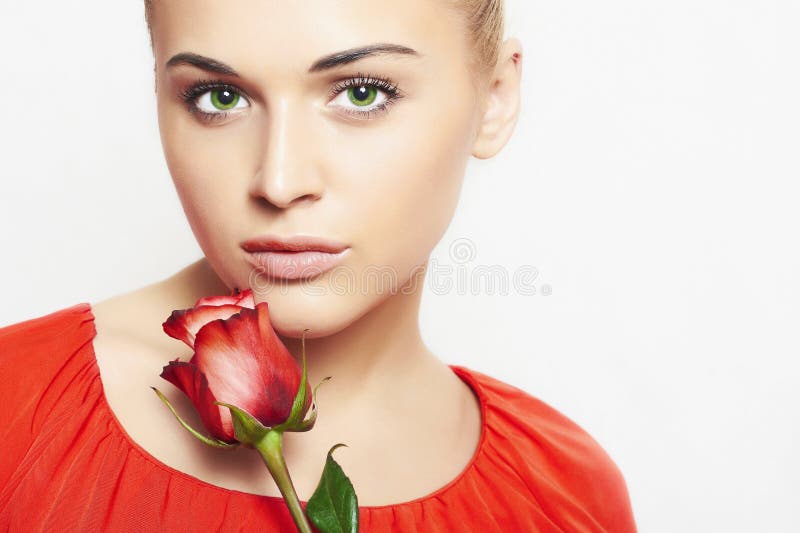 Isolated beautiful woman with flowers. girl and flower. beautiful blond girl in red dress. close-up portrait. Red rose
