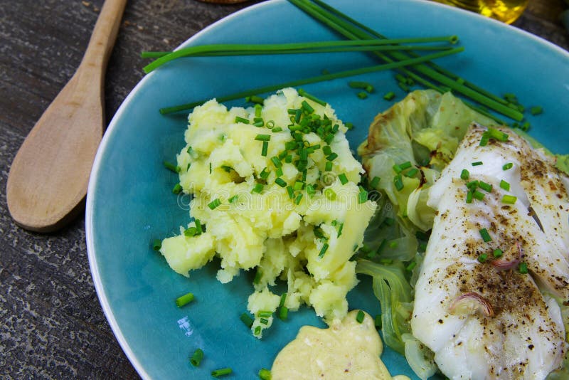 Isolated Blue China Dish with Codfish Fillet Poached on Pointed Cabbage ...