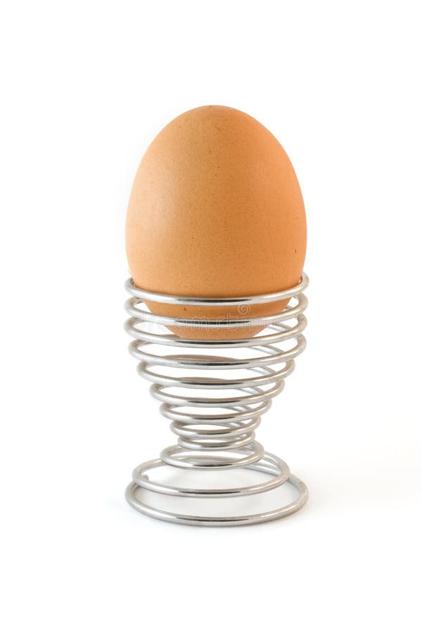 Isolated boiled egg in metal egg cup