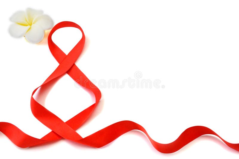 Isolated bright red satin ribbon in the shape of the figure 8 and white with yellow flower on a white background with copy space