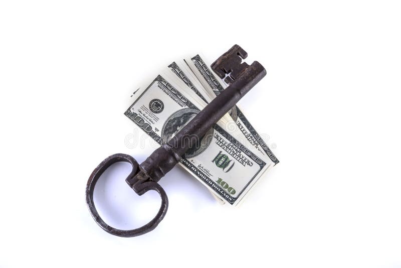 Isolated old vintage big key and money. Isolated old vintage big key and money