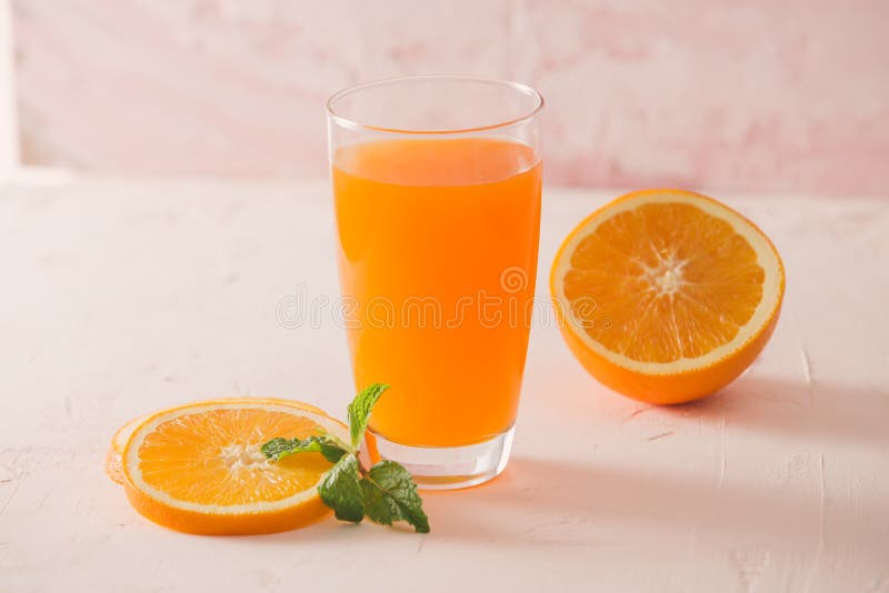 Isolated orange juice with slices of oranges on white background. 100 percent fresh and organic. Sweet juicy cocktail in glass. stock photos Isolated orange juice with slices of oranges on white background. 100 percent fresh and organic. Sweet juicy cocktail in glass. stock photos