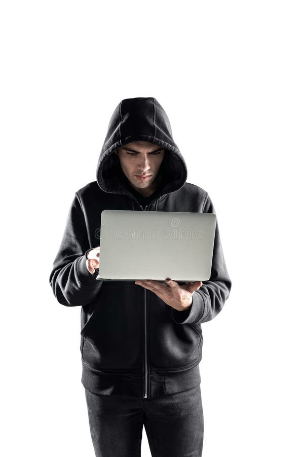 Serious young hacker with laptop, isolated stock photo