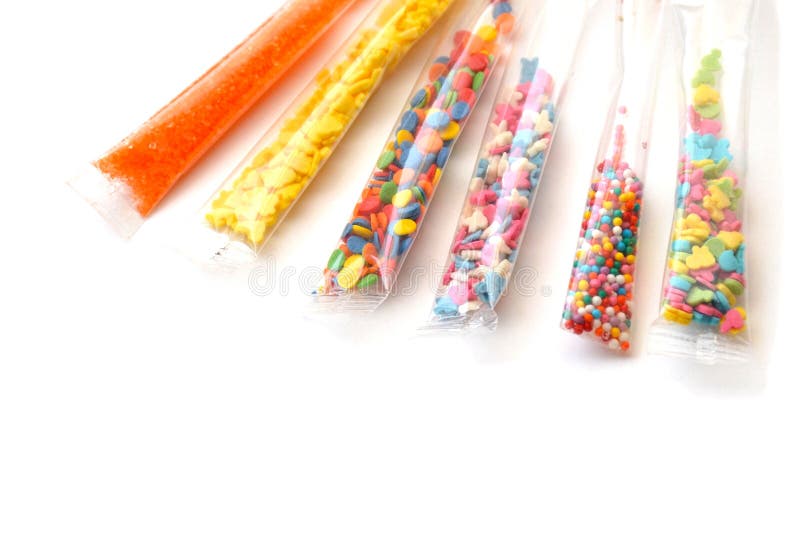 Isolated set of bright confectionery toppings in six small transparent packages on a white background royalty free stock photo Isolated set of bright confectionery toppings in six small transparent packages on a white background royalty free stock photo