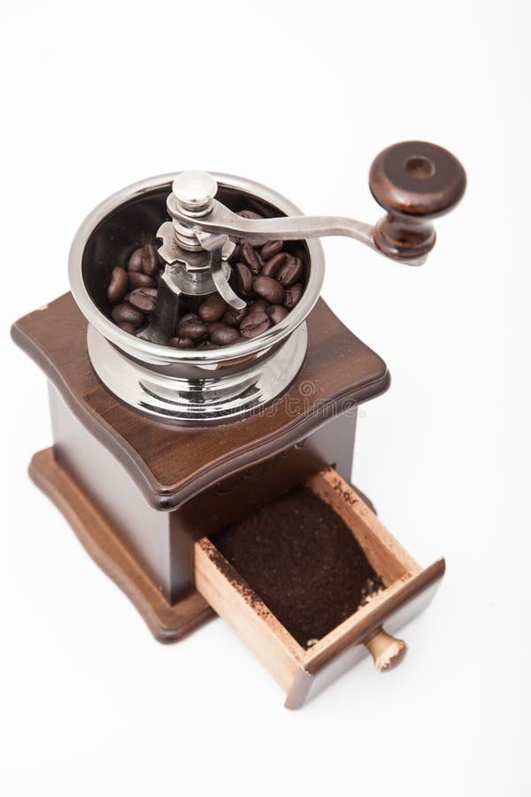 Isolated Vintage Coffee Bean Grinder and Fresh Ground Coffee Stock