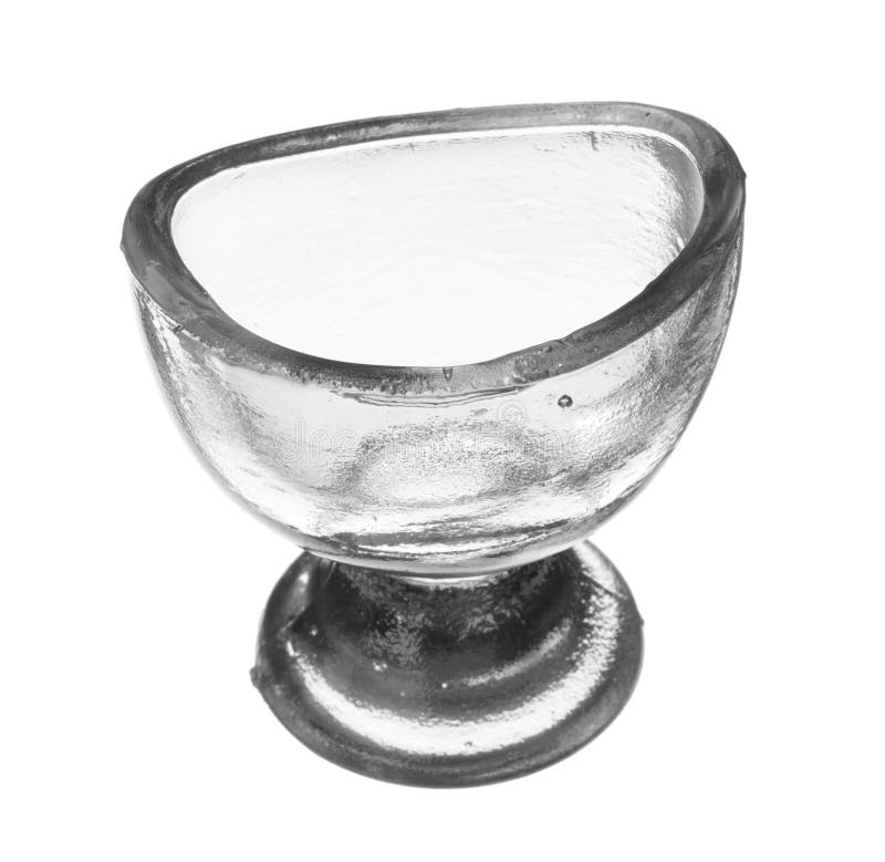 Isolated Vintage Glass Eye Wash Rinse Cup stock photography.