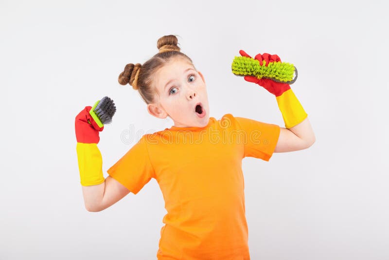 Cute little girl in gloves with brushes