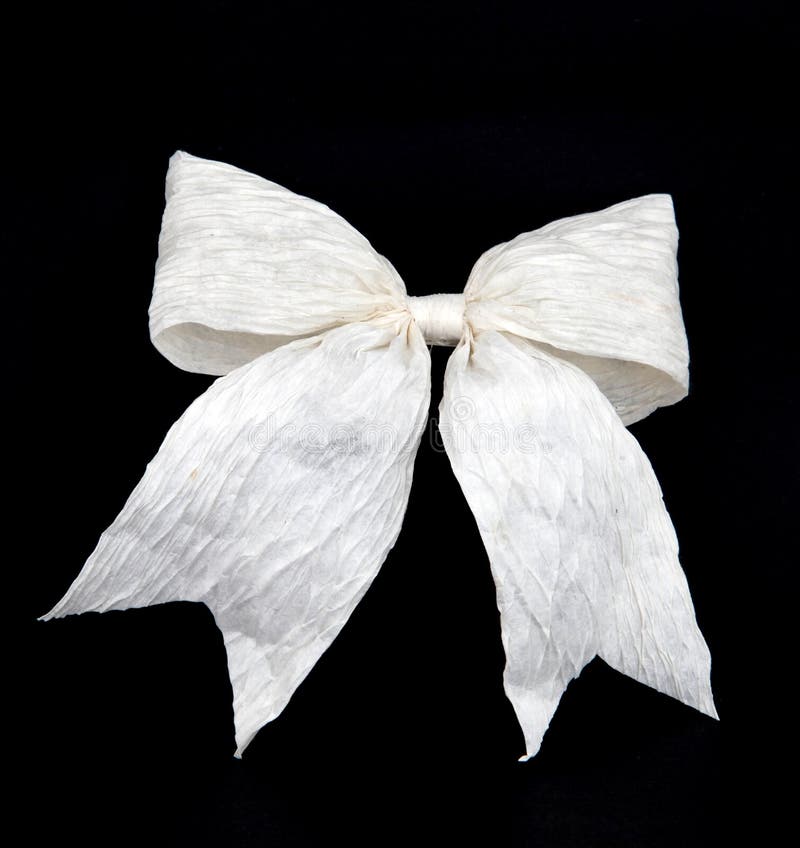 Isolated white bow for holiday gift box on black