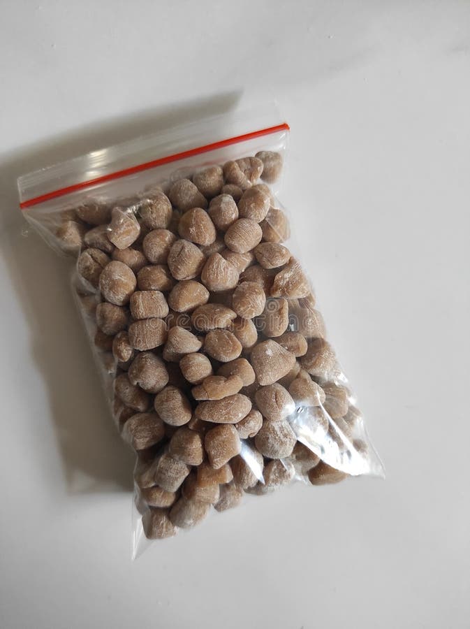 Isolated on White of Raw Tapioca Pearls in a Plastic Wrap Stock Photo