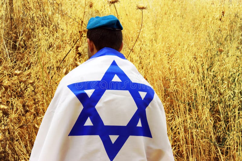 Israeli Soldier, Patriot of the Jewish State, with a large Flag of Israel. Photo for Israel Independence Day, Memorial Day, Holocaust Remembrance Day. Israeli Soldier, IDF. Israeli Soldier, Patriot of the Jewish State, with a large Flag of Israel. Photo for Israel Independence Day, Memorial Day, Holocaust Remembrance Day. Israeli Soldier, IDF.