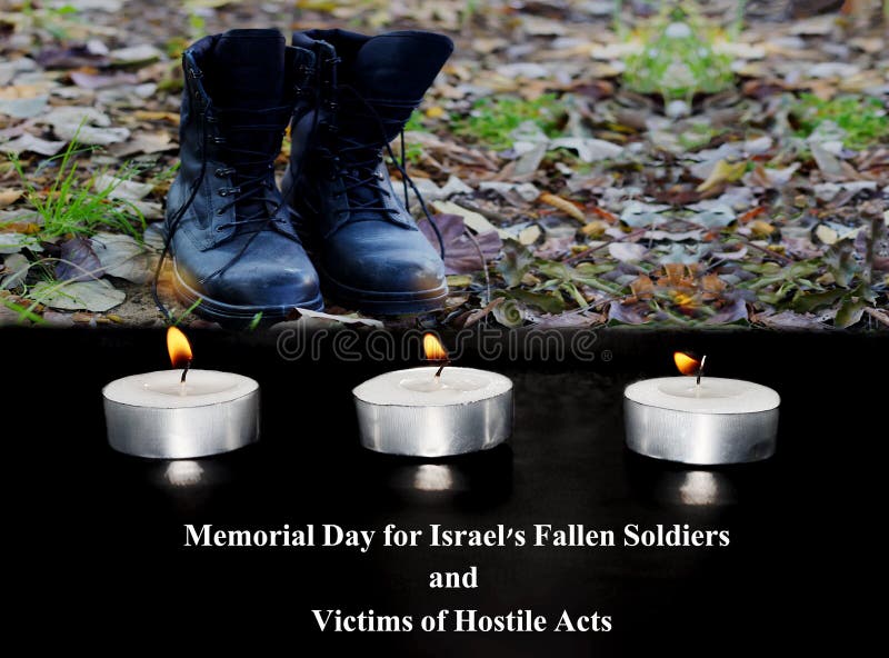 Israel Memorial Day for Fallen Soldiers and Victims of Hostile Acts. In the front is a burning funeral candles, background - blurred Israeli soldier military boots - IDF army. Israel Memorial Day for Fallen Soldiers and Victims of Hostile Acts. In the front is a burning funeral candles, background - blurred Israeli soldier military boots - IDF army