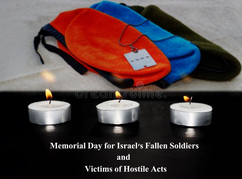 Israel Memorial Day for Fallen Soldiers and Victims of Hostile Acts. In the front is a burning funeral candles, background - blurred semi transparent army army berets and a soldier`s medallion IDF. Israel Memorial Day for Fallen Soldiers and Victims of Hostile Acts. In the front is a burning funeral candles, background - blurred semi transparent army army berets and a soldier`s medallion IDF