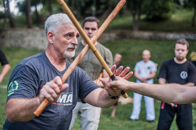 Escrima and kapap instructor demonstrates sticks fighting