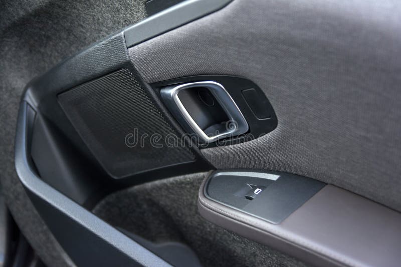 ISTANBUL, TURKEY, MAY 17, 2016: Door and handle detail from BMW i3, a B-class, high-roof hatchback manufactured and marketed by BMW with an electric powertrain using rear wheel drive. ISTANBUL, TURKEY, MAY 17, 2016: Door and handle detail from BMW i3, a B-class, high-roof hatchback manufactured and marketed by BMW with an electric powertrain using rear wheel drive.