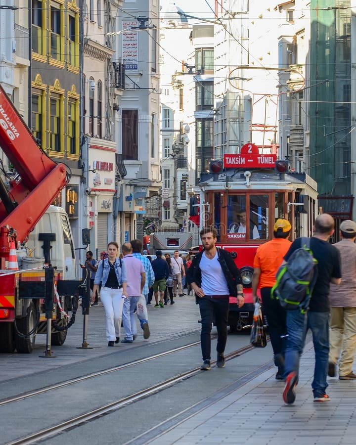 Istanbul, TURKEY, September 18, 2018. Red retro tram rides along the busy Istiklal street in Istanbul stock photography Istanbul, TURKEY, September 18, 2018. Red retro tram rides along the busy Istiklal street in Istanbul stock photography