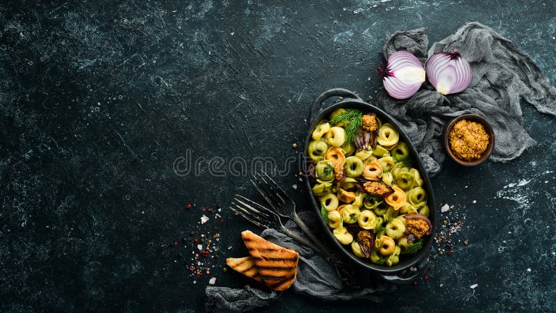 Italian cuisine. Ravioli with onions and mustard. Top view. Free space for your text. Rustic style. Italian cuisine. Ravioli with onions and mustard. Top view. Free space for your text. Rustic style