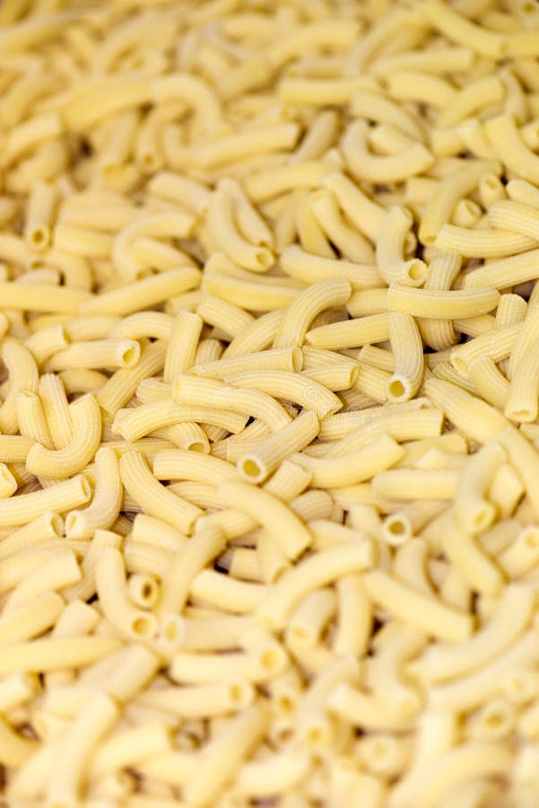 Italiaanse Penne Rigate Macaroni Pasta-achtergrond royalty-vrije stock afbeeldingen Italiaanse Penne Rigate Macaroni Pasta-achtergrond royalty-vrije stock afbeeldingen