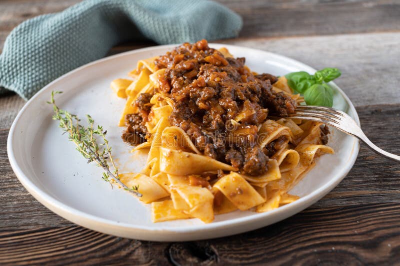 Italian Bolognese Ragout with Duck with and Pasta on a Plate Stock ...