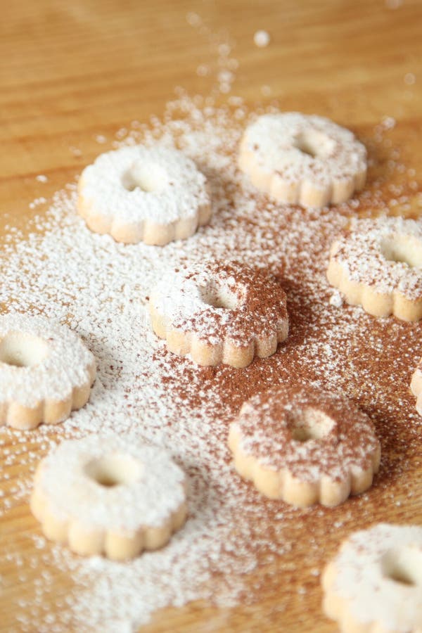 Italian canestrelli biscuits sprinkled with powdered sugar and cocoa stock photography